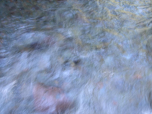 Multicolor blur of a rushing river