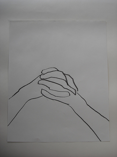 contour drawing of clasped hands