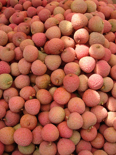 Random array of lychees with a splash of light