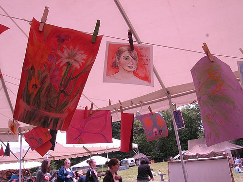 Drawings hanging on a clothesline.