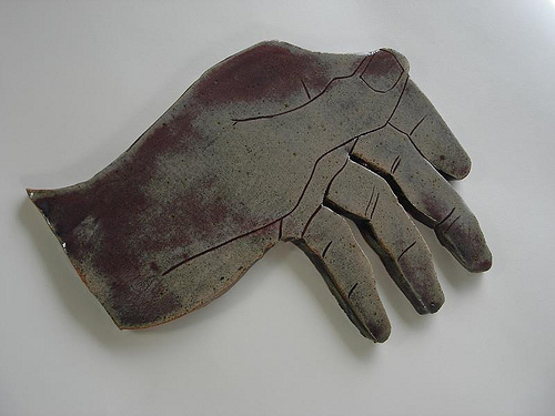 Hand-shaped ceramic piece