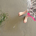 Seaweed, feet and sand.