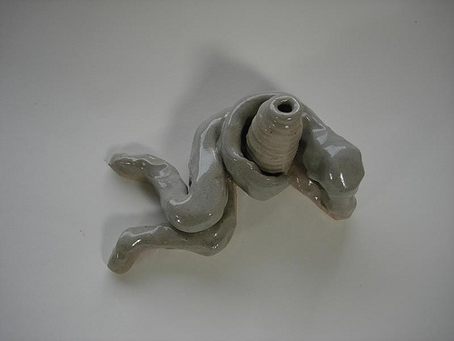 reclining figure with coil pot